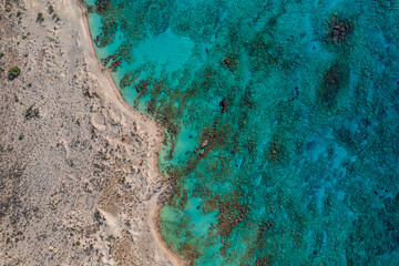 Fototapeta na wymiar Aerial drone photo of paradise turquoise secluded sandy white and pink beach of Elafonisi in South West Crete island, Greece