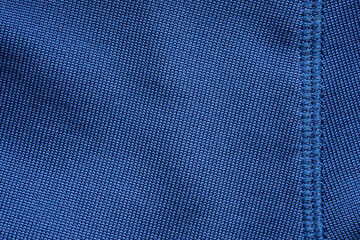 Blue sports clothing fabric football shirt jersey texture with stitches