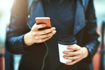 Hands, coffee and phone for texting in city, internet scroll and web browsing. Cellphone, hand and...