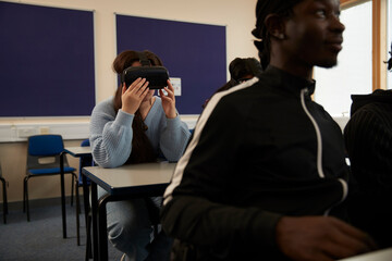 Student putting on VR headset in class
