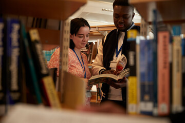 University students reading books in library