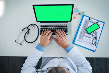 Laptop, green screen and doctor hands with medicine, documents or healthcare service, research and mockup above. Space, telehealth and pills with medical person typing, phone mock up and computer app