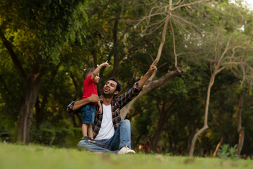 Naklejka na ściany i meble parent and child in the park