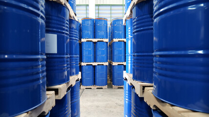 a blue barrel In the warehouse, 200-liter chemical barrels are arranged on wooden pallets and...