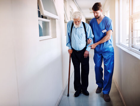 Nurse, Senior Patient And Help Walking, Moving Or Healthcare In Nursing Home, Retirement And Medical Caregiver. Elderly, Man And Support From Physical Therapy, Doctor Or Health Care In Hospital