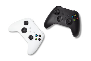 photo of used white and black gamepads console controllers isolated over a transparent background,...