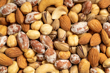 Mixed nuts. Special mixed nuts in a wooden bowl. Nuts, pistachios, peanuts, cashews, almonds. superfood. Nuts food concept. healthy snacks. Top view