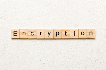 encryption word written on wood block. encryption text on table, concept