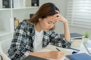 Asian student woman have anxiety because of exams, female prepare for test and learning lessons in the library. stress, despair, haste, misunderstanding reading, discouraged, expectation, knowledge