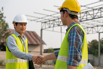 Construction worker team hands shaking greeting start up plan new project contract in office center at construction site, industry ,architecture, partner, teamwork, agreement, property, contacts..