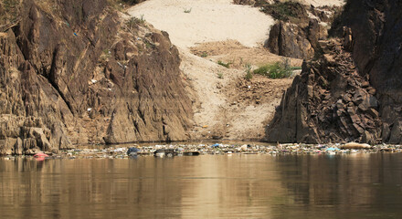 Garbage, plastic and debris floating downstream on the Mekong river between Huay Xay and Pak Beng, Laos.