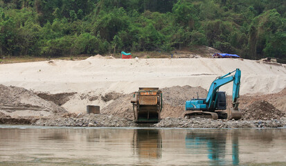 Semi-industrial private gold mining on the Mekong River between Huay Xai and Luang Prabang.
