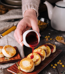 cottage cheese cakes poured with berry jam