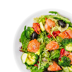 Salad of baked fish salmon, broccoli, lettuce top view