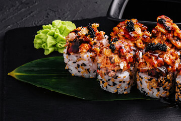 Sushi roll- gourmet fast food on black stone