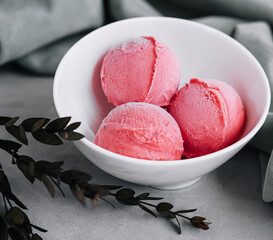 Tasty strawberry ice-cream balls in bowl