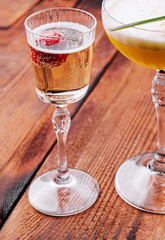 sweet alcoholic orange cocktail with foam and champagne