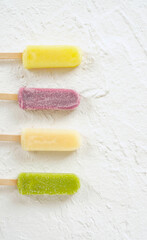 frozen pops arranged on white background material.  白い背景素材の上に並べたアイスキャンディー