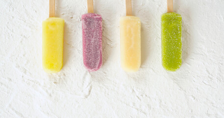frozen pops arranged on white background material.  白い背景素材の上に並べたアイスキャンディー