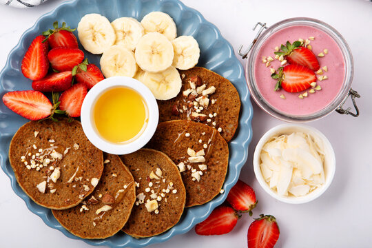 Gluten free Homemade Vegan Banana Pancakes for Breakfast on Gray Background.
