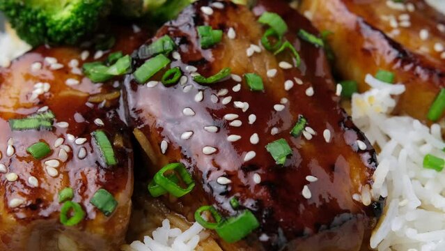 Teriyaki Pork Belly with broccoli, spring onion and rice. Rotating video