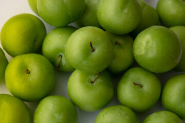 fresh green plum as food background