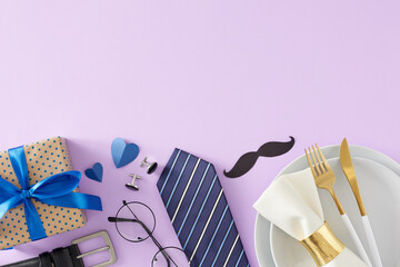 Father's Day table setting concept. Top view flat lay of plate cutlery napkin gift box mustache necktie glasses and blue hearts on light violet background with empty space for text or logo