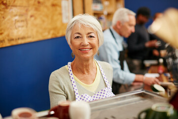 Senior woman, portrait and coffee shop owner work for retirement in a store with a smile. Elderly female, barista and cafe for a small business as a startup for profit or pension in a restaurant