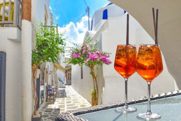Two Aperol Spritz  in a traditional village on a Greek island of the Cyclades