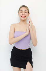 Portrait isolated cutout closeup shot of millennial Asian young beautiful sexy long hair model in seamless tube cropped top standing posing crossed arms look at camera on white background copy space
