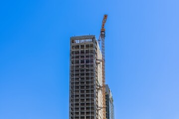 The subject of the photo is the construction of a building of a business center or residential building