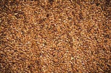 Brown flax seeds. Healthy food on the pile, may be used as background. - 603644738