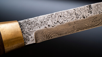 Damascus steel knives on a black background. Kitchen knives. background with japanese knife. A set...