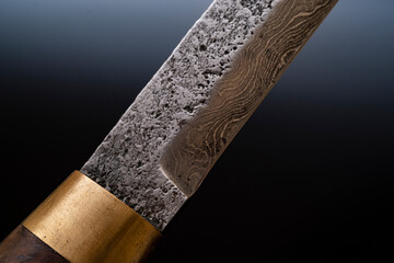 Damascus steel knives on a black background. Kitchen knives. background with japanese knife. A set of Japanese Damascus steel knives. Banner © Alexander LW