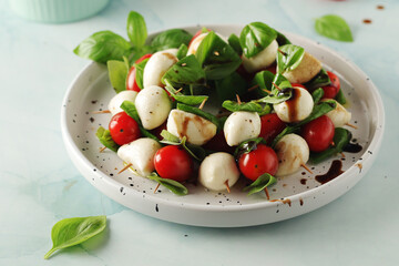A plate with Italian salad caprese canape