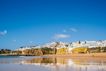 Great view of Fisherman Beach, Praia dos Pescadores, with whitewashed houses on cliff, Albufeira,...
