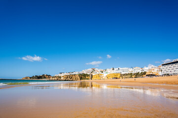 Naklejka na ściany i meble Great view of Fisherman Beach, Praia dos Pescadores, with whitewashed houses on cliff, Albufeira, Algarve, Portugal