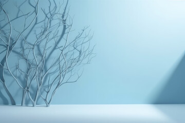 Minimalistic abstract gentle light blue background for product presentation with light and intricate shadow from tree branches on wall. 