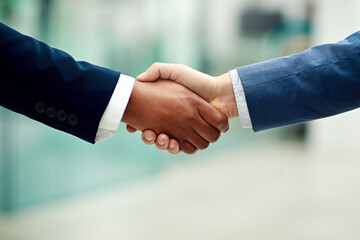 Closeup, corporate and business people shaking hands in office for partnership, introduction and...