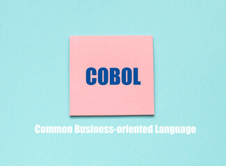COBOL Common Business-oriented Language words on pieces of paper.