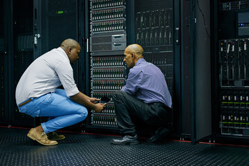 Server room, men or technicians talking about hardware together for a cybersecurity glitch with teamwork. IT support, collaboration or African engineers fixing network for information technology