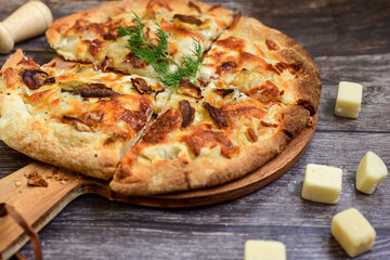 Tasty hot italian focaccia  pizza   with porcini mushroom,and cheese. Pizzeria menu. Concept poster for Restaurants or pizzerias. Top view