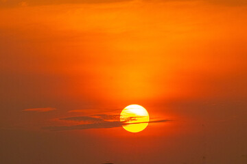 Deep orange sundown in sky at sunset.