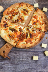 Tasty hot italian focaccia  pizza   with porcini mushroom,and cheese. Pizzeria menu. Concept poster for Restaurants or pizzerias. Top view