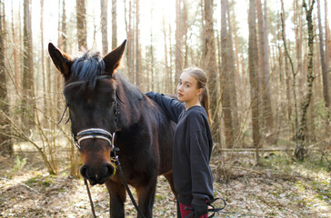 a young girl jockey trains to ride a horse
