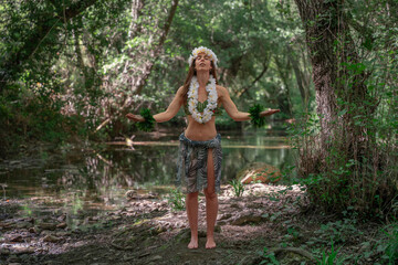 Hula dancer meditating in nature.