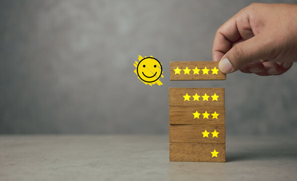 Feedback rating and positive customer review experience, service and Satisfaction. Customers choosing wood block with 5 star and happy face icon to give satisfaction in service. Rating very impressed.