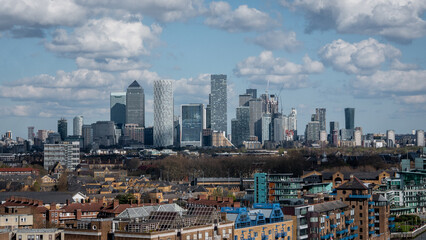 london Canary Wharf business district with residential buildings in the foreground on an overcast...
