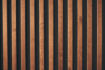 Wall decor with wooden vertical bars. A modern way of decorating walls in rooms, apartments and...