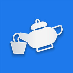 Paper cut Traditional Chinese tea ceremony icon isolated on blue background. Teapot with cup. Paper art style. Vector